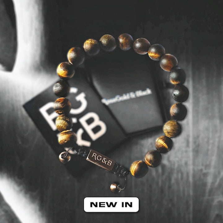 Tiger's Eye Bead Bracelet - Our Tiger’s Eye Bead Bracelet Features Natural Stones, Waxed Cord and Brushed Rose Gold Steel Hardware. A Beautiful Addition to any Collection.
